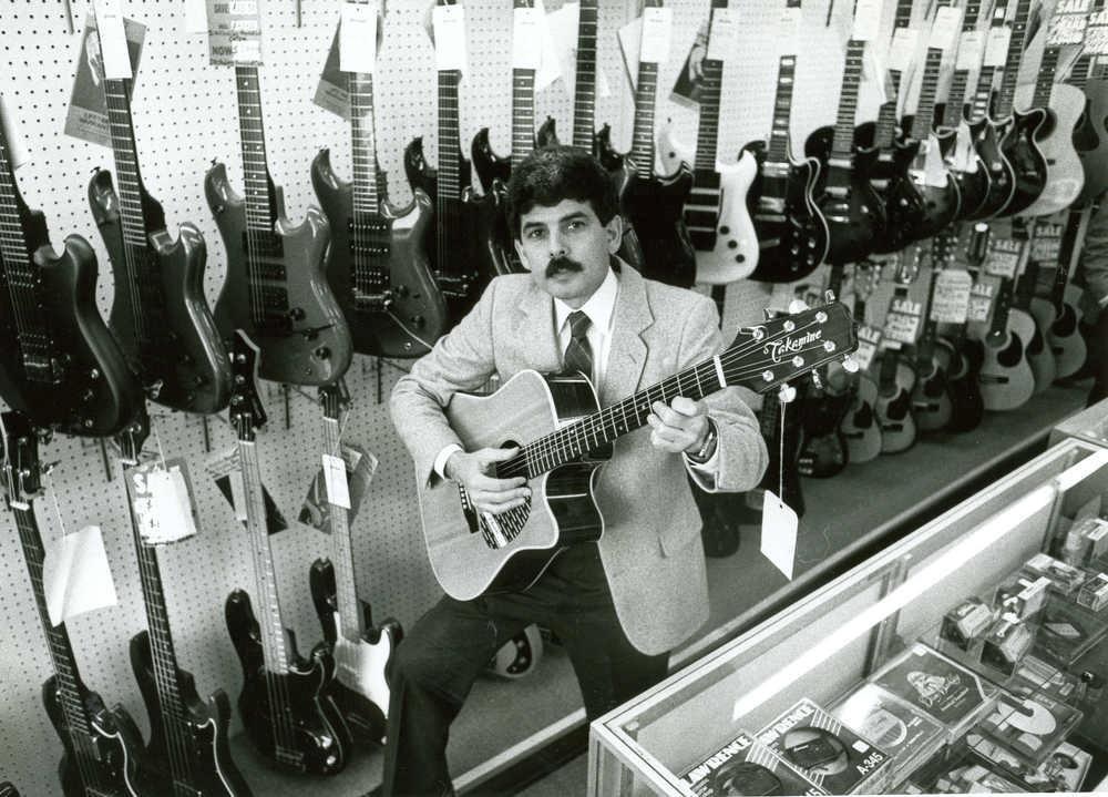 historical photo of Jerry Portman with a guitar